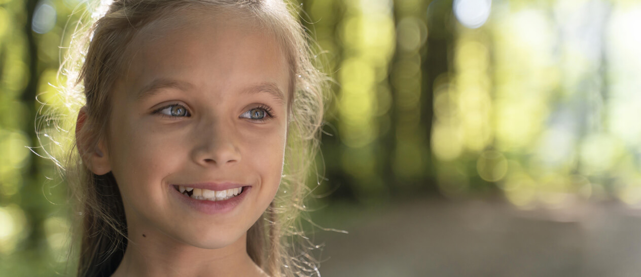 kid smiles after hearing Signs you need braces